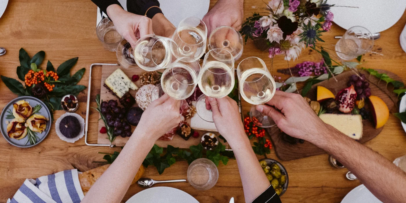 Guests sharing a toast around a table